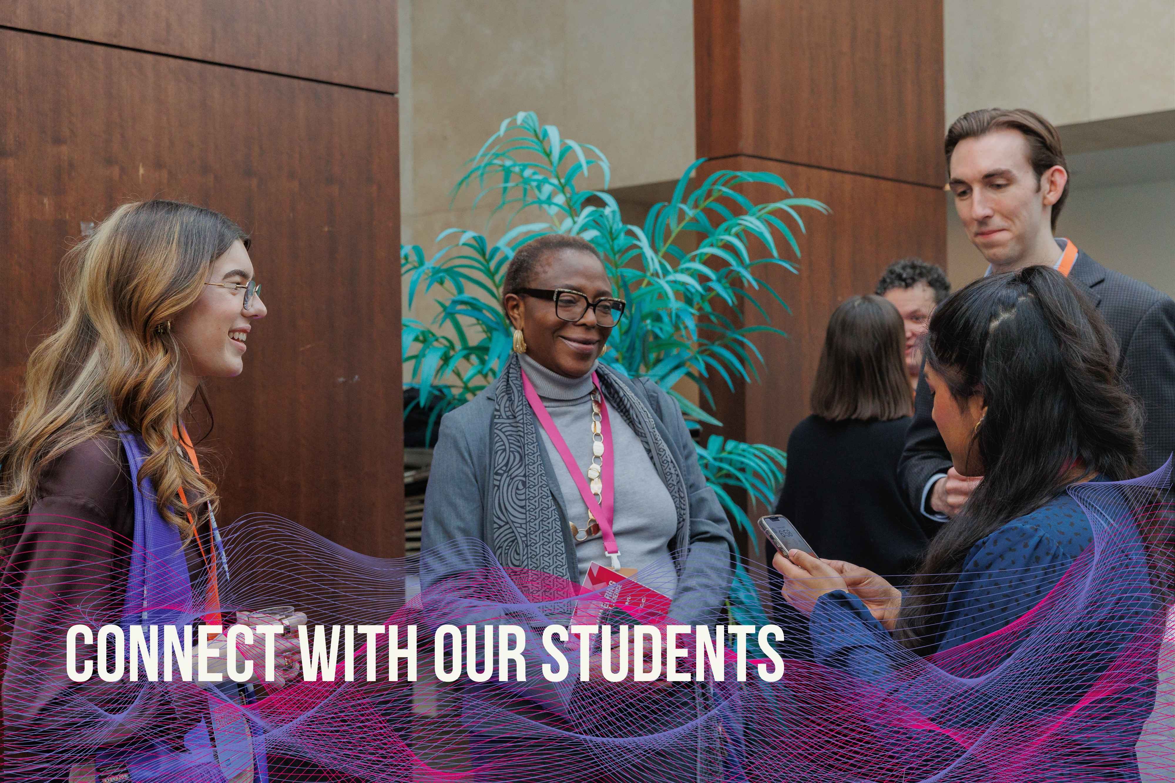 two people sharing a laptop